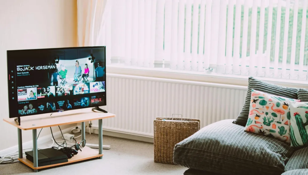 turned on flat screen smart television ahead